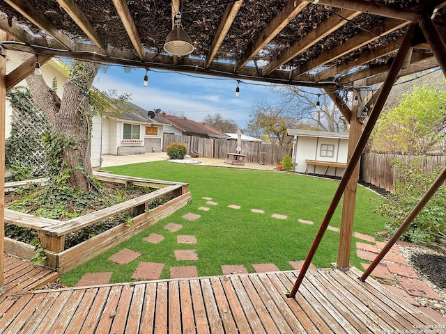 view of yard featuring a pergola, an outdoor structure, and a deck