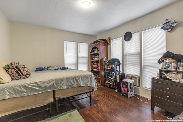 bedroom featuring dark hardwood / wood-style floors