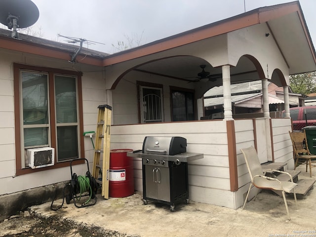 view of patio / terrace featuring a grill and cooling unit