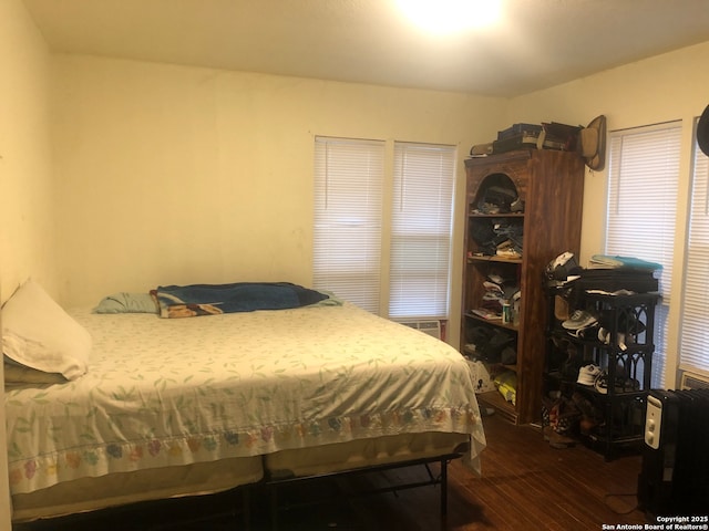 bedroom featuring dark hardwood / wood-style floors