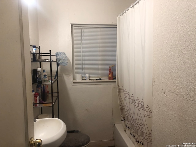 bathroom featuring shower / bath combination with curtain