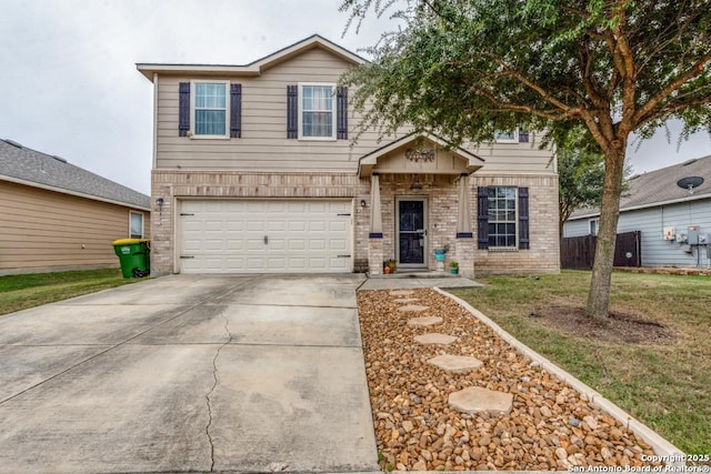 view of front of property featuring a front lawn and a garage