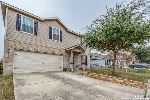 view of front of home featuring a garage and a front lawn