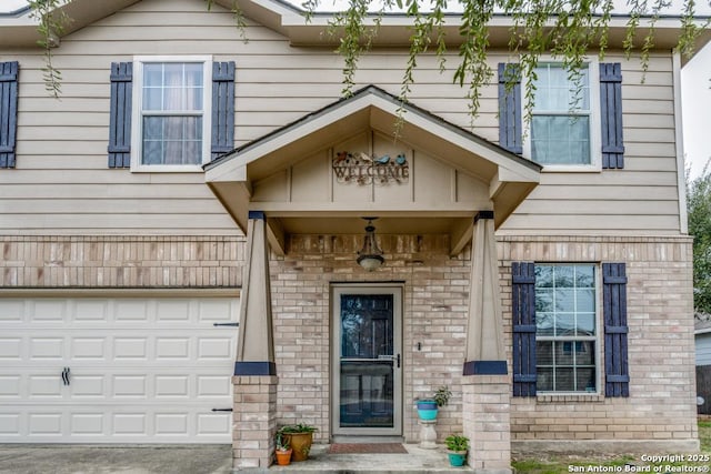 view of exterior entry featuring a garage