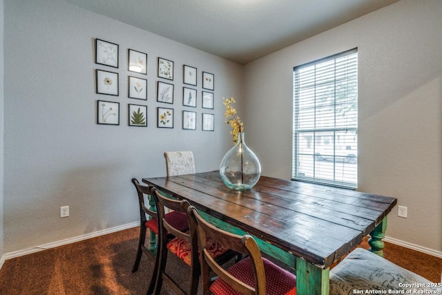 view of carpeted dining area