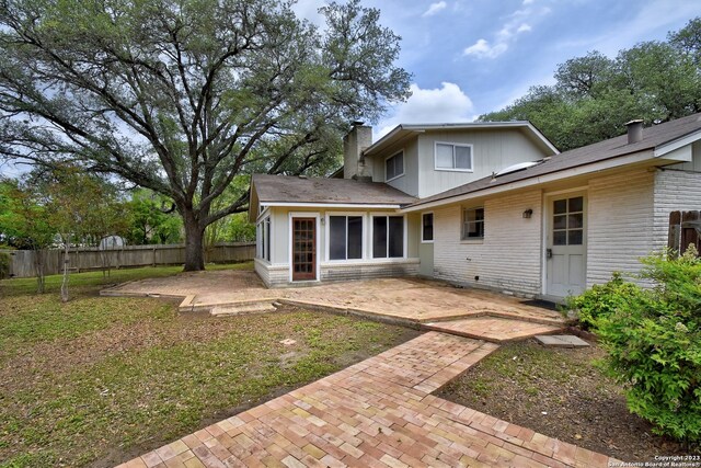 rear view of property with a patio