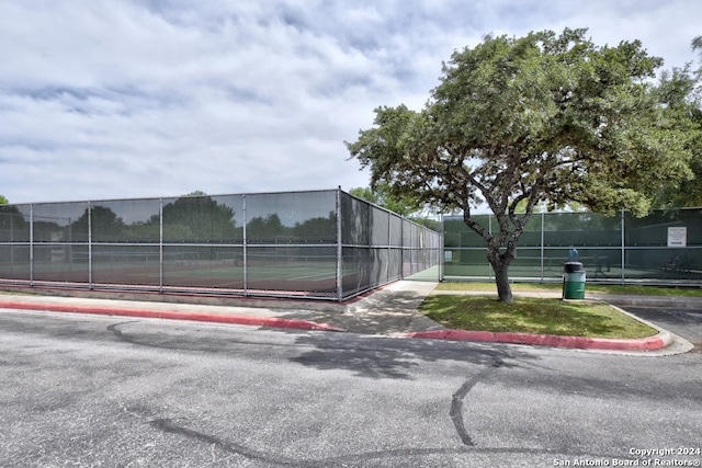 view of sport court with fence