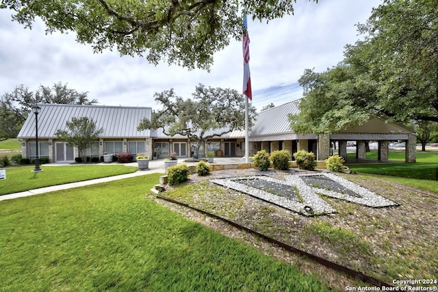 view of community with a yard