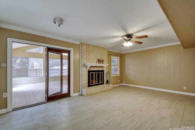 unfurnished living room with ceiling fan, crown molding, and light hardwood / wood-style flooring