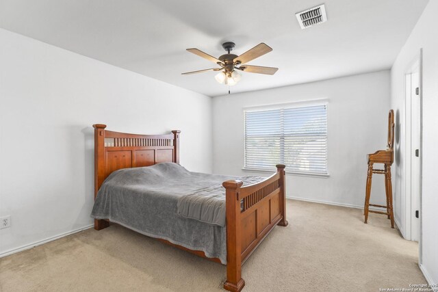 bedroom featuring light colored carpet and ceiling fan