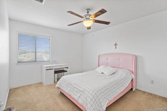 bedroom with light colored carpet and ceiling fan