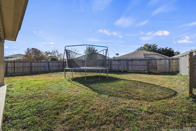 view of yard with a trampoline