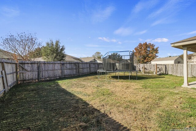 view of yard with a trampoline