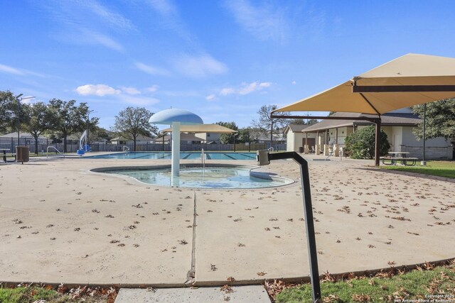 view of swimming pool with a patio area