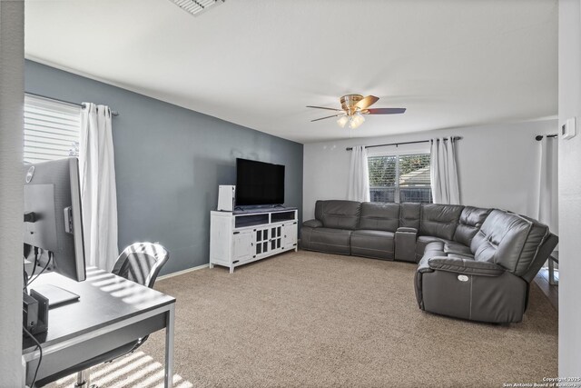 carpeted living room featuring ceiling fan