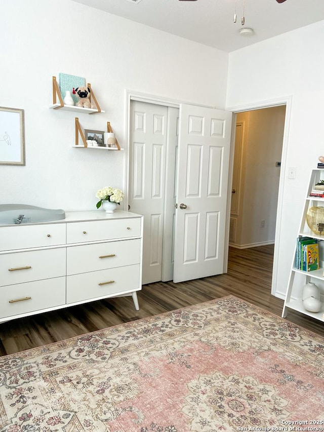 unfurnished bedroom with a closet and dark hardwood / wood-style flooring