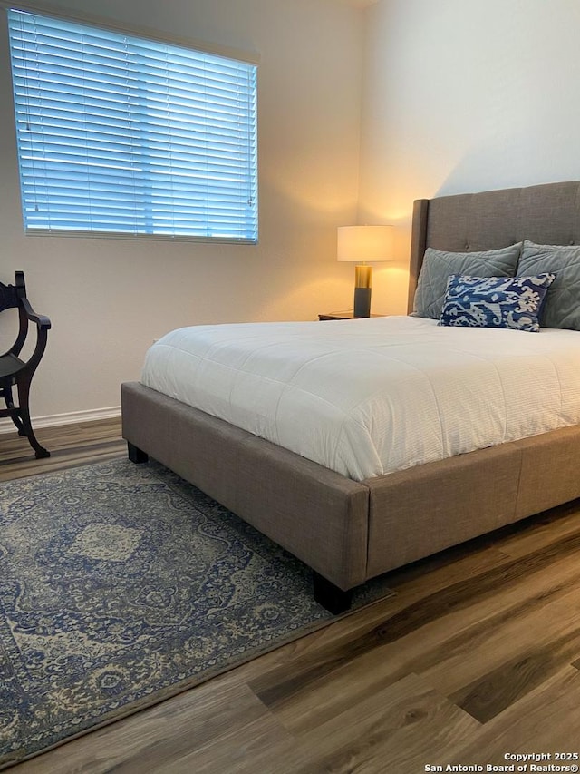 bedroom featuring wood-type flooring