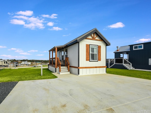 view of side of property with a yard