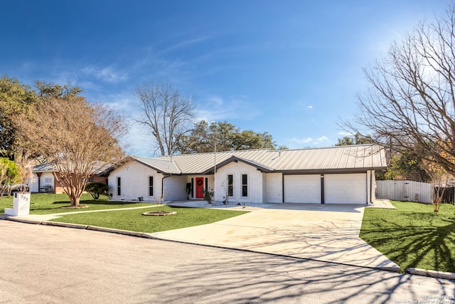 view of front facade with a front lawn and a garage