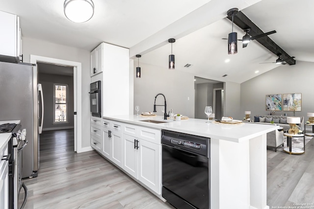 kitchen featuring ceiling fan, black appliances, sink, vaulted ceiling with beams, and white cabinetry