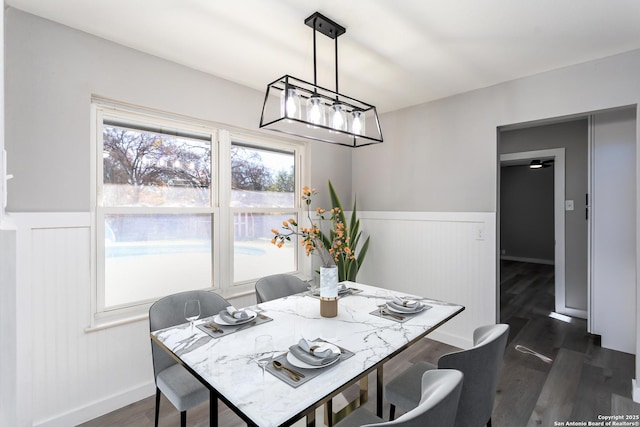 dining space featuring dark hardwood / wood-style floors