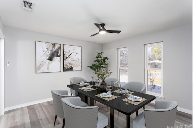 dining room featuring ceiling fan and light hardwood / wood-style flooring