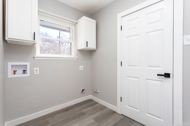 laundry area with washer hookup, light hardwood / wood-style floors, cabinets, and hookup for an electric dryer