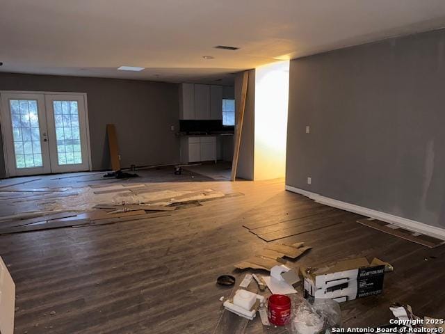 unfurnished living room with french doors