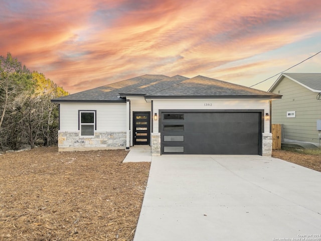 prairie-style home featuring a garage