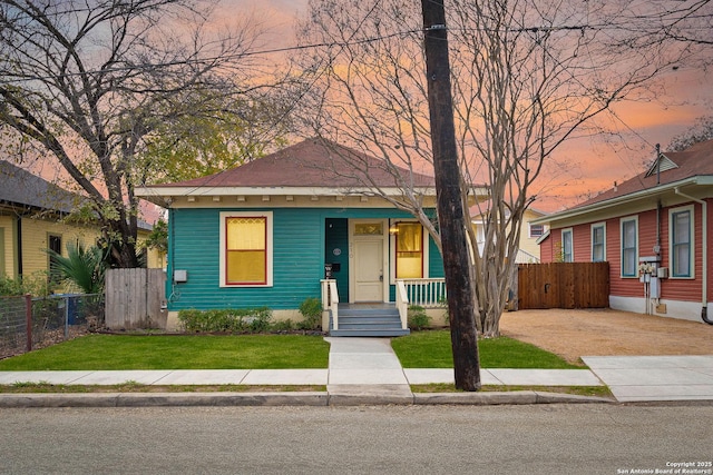 bungalow-style home featuring a yard