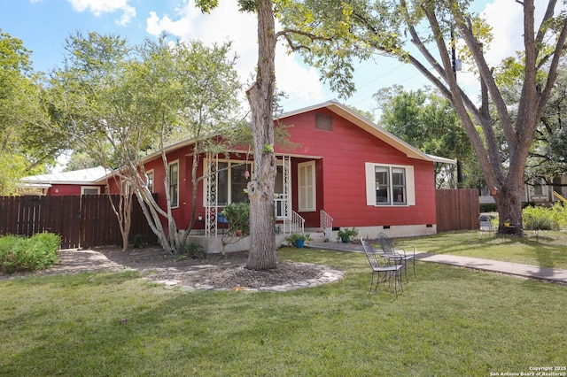 951 W Coll St, New Braunfels, TX 78132 - view of front of house featuring a porch and a front lawn