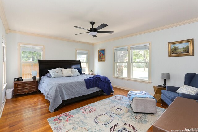 951 W Coll St, New Braunfels, TX 78132 - bedroom featuring multiple windows, hardwood / wood-style floors, ceiling fan, and crown molding