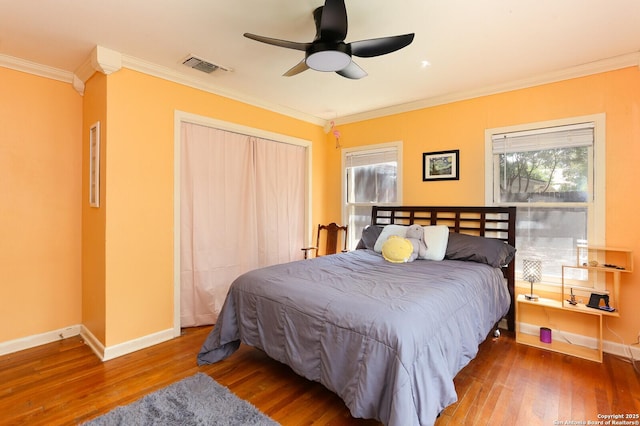 951 W Coll St, New Braunfels, TX 78132 - bedroom with ceiling fan, wood-type flooring, crown molding, and multiple windows