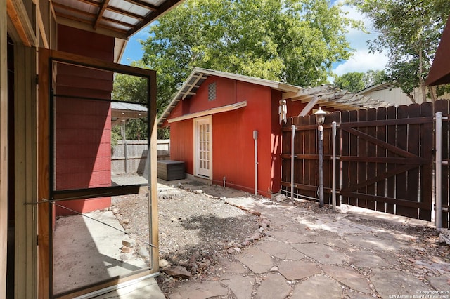 951 W Coll St, New Braunfels, TX 78132 - view of patio featuring an outdoor structure