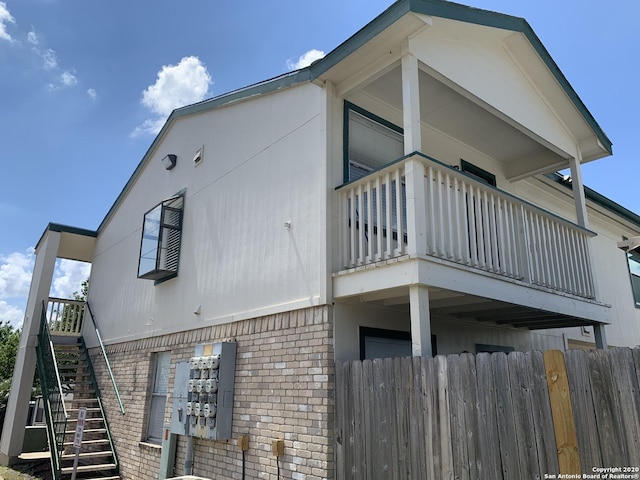 view of property exterior featuring a balcony