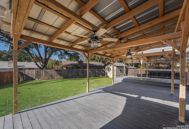 deck featuring a lawn and ceiling fan