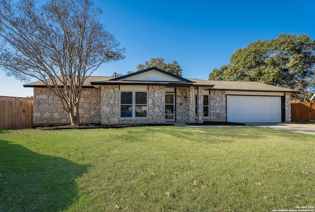 single story home with a garage and a front yard