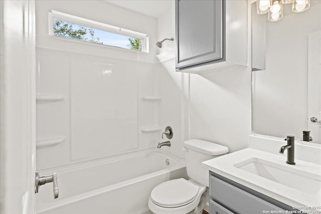 full bathroom featuring vanity, bathing tub / shower combination, and toilet