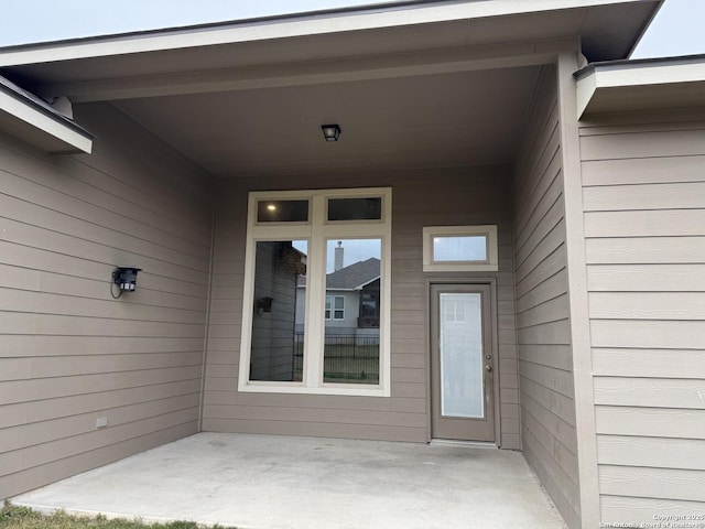 entrance to property with a patio area