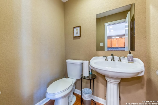 bathroom featuring toilet