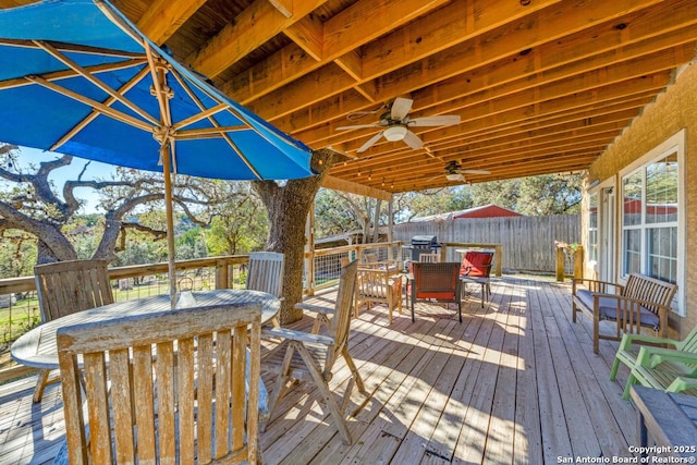 wooden terrace featuring ceiling fan