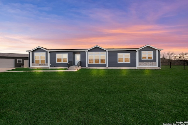 ranch-style house featuring a yard