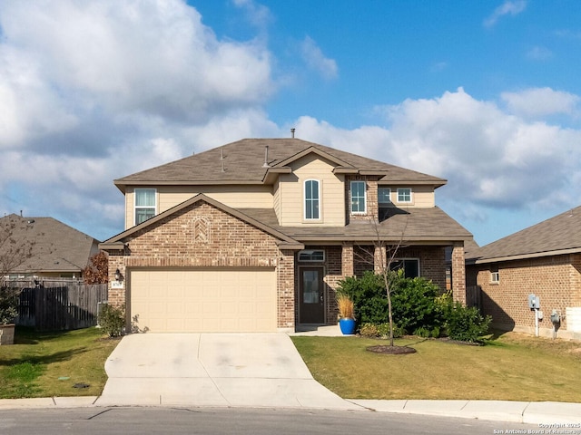 front of property featuring a garage and a front lawn