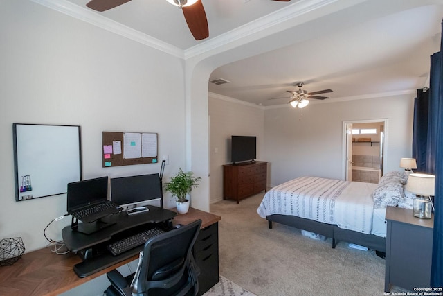 carpeted bedroom featuring ornamental molding, connected bathroom, and ceiling fan