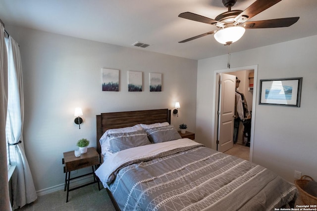 bedroom featuring light carpet and ceiling fan