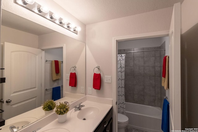 full bathroom featuring shower / tub combo with curtain, vanity, a textured ceiling, and toilet