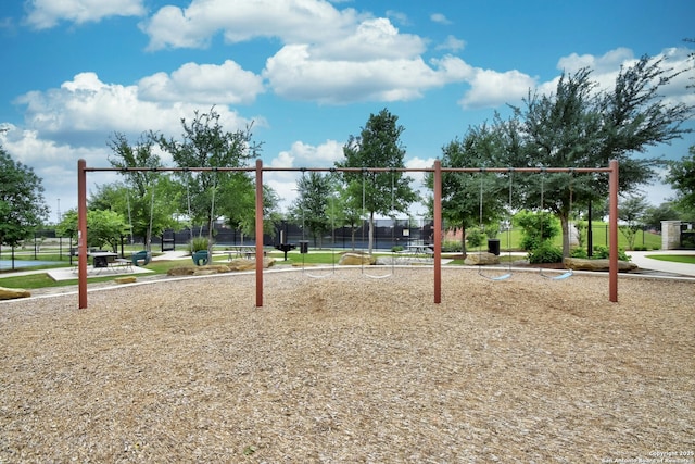 view of property's community with a playground