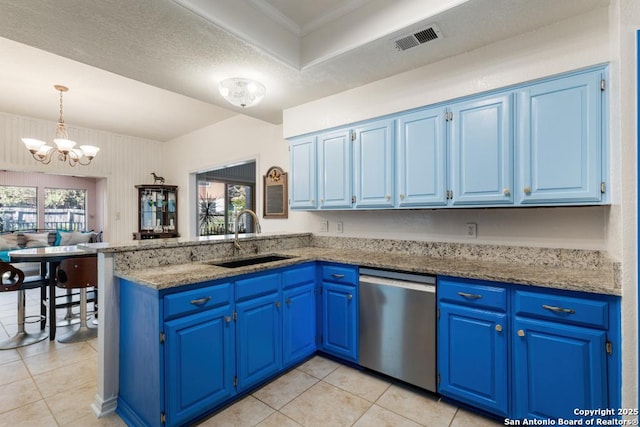 kitchen featuring stainless steel dishwasher, sink, blue cabinetry, a notable chandelier, and plenty of natural light