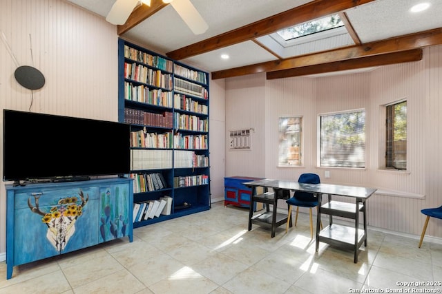 tiled home office featuring beam ceiling, built in shelves, and ceiling fan