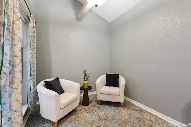 living area featuring vaulted ceiling